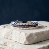 Set of three navy and cream bracelets: braided, woven and beaded